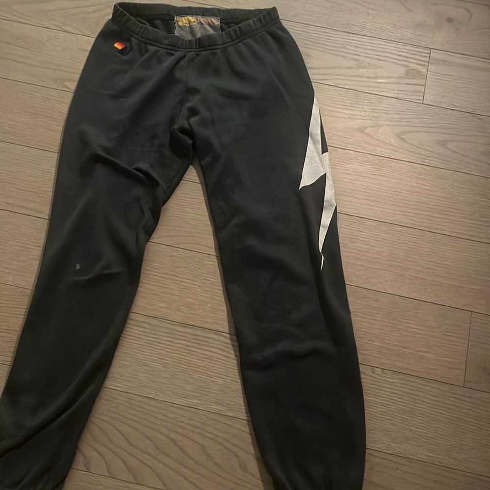Gray Aviator Nation sweatpants with lighting bolt